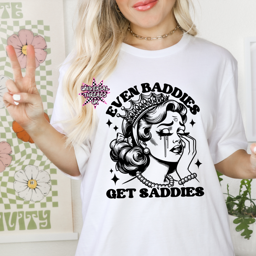 Even Baddies Get Saddies graphic t-shirt in white with black slogan, available in UK sizes 6–34
